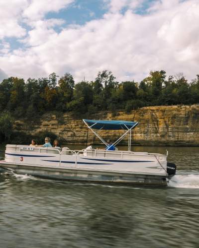 A boat cruises along the Illinois River