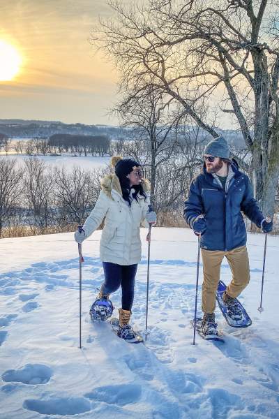 A Couple enjoying skiing.