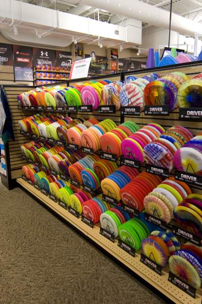 A colorful rack of Frisbees tempts shoppers at a sporting goods store in Illinois. 