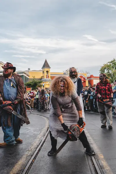 A group of zombies walk through Six Flags