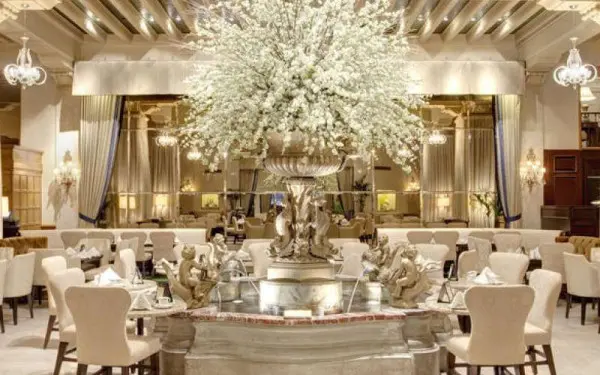 An empty ornate dining room at the Palm Court Hotel in Chicago 