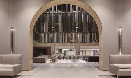 Interior of a neutral toned lobby.