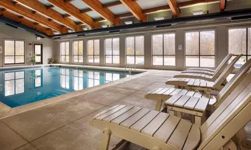 Pool loungers by an indoor pool