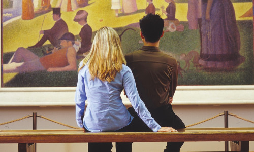 Couple staring at a painting 