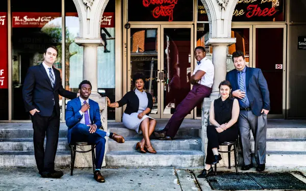 The cast of the award-winning show, Discontent, pose outside Second City Comedy Club in Chicago.
