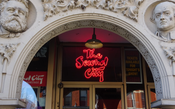 Neon sign for The Second City above theatre entrance