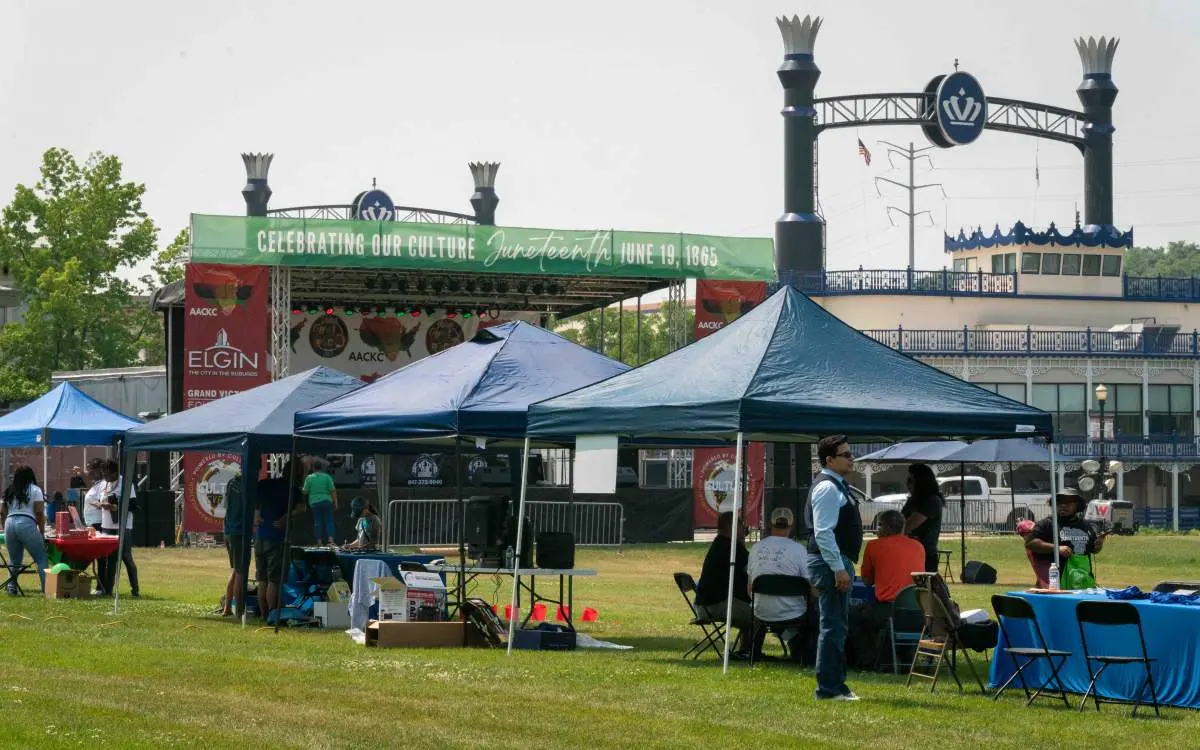 A grouping of vendor tents at a Juneteenth festival in Elgin