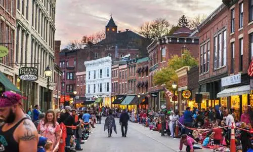Main street of Galena filled with people in halloween costumes.
