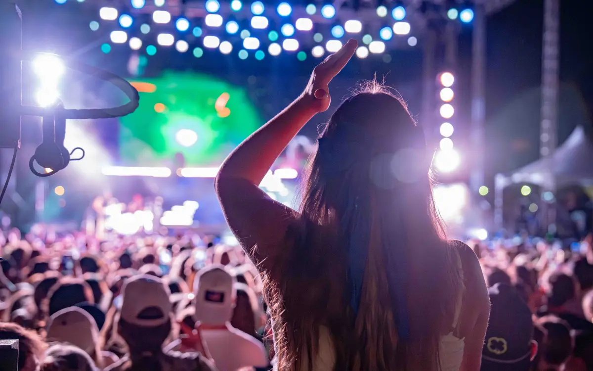 Girl on shoulders in a crowd