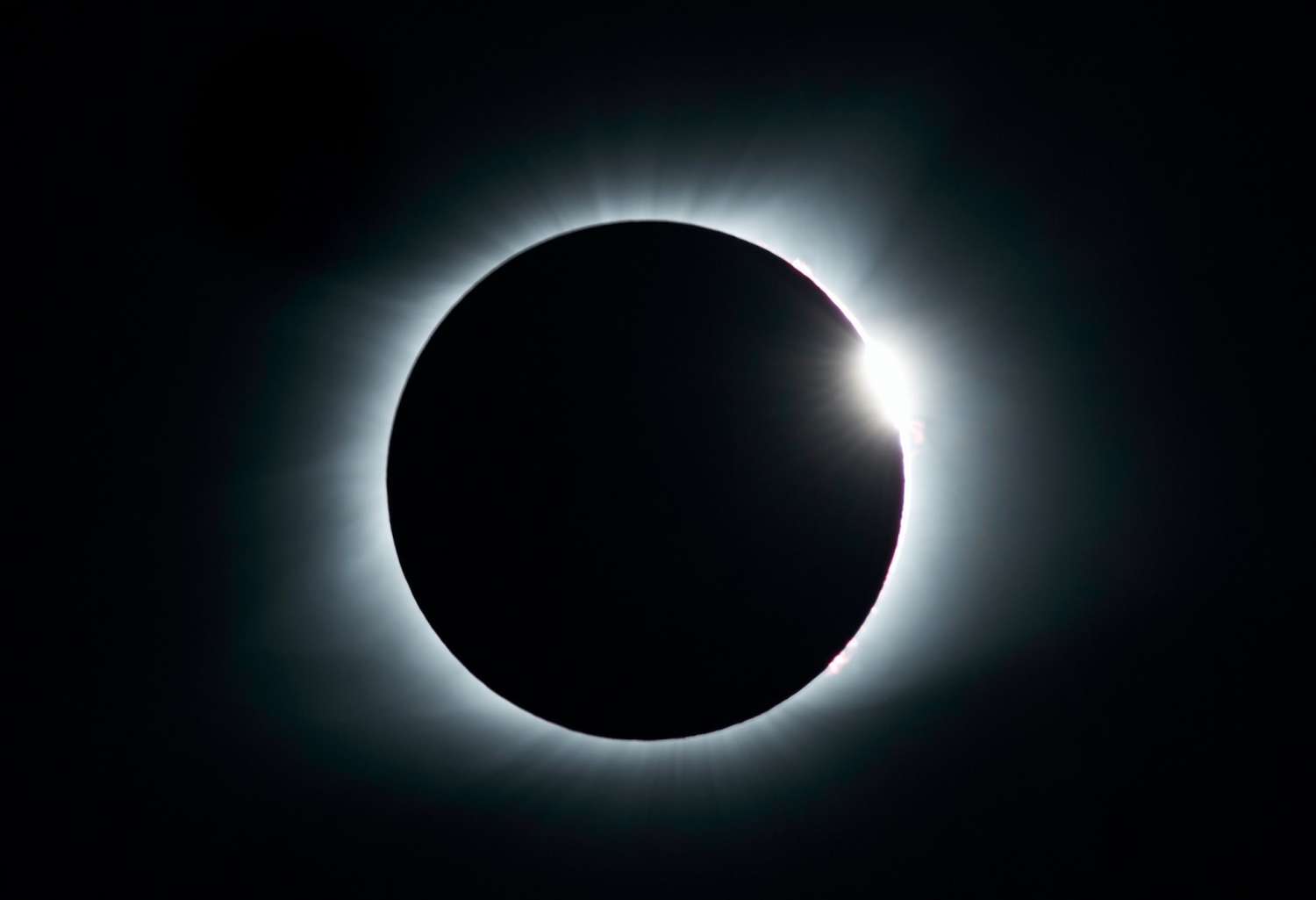 The moon passes in front of the sun for a solar eclipse