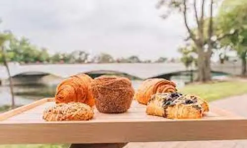 Variety of pastries from Atrevete Confections on a wooden board.