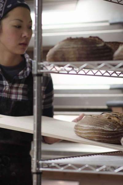 Jojo Gendenbaatar of Crust and Crumbles baking bread in a kitchen
