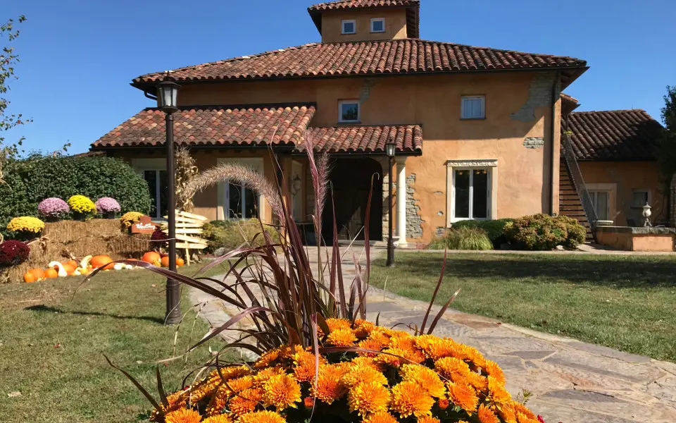 A vineyard house with flowers
