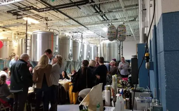 People gathered in brewery