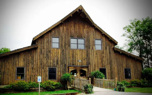 The exterior of the wooden building at the Grapevine Sleepy Creek Vineyard