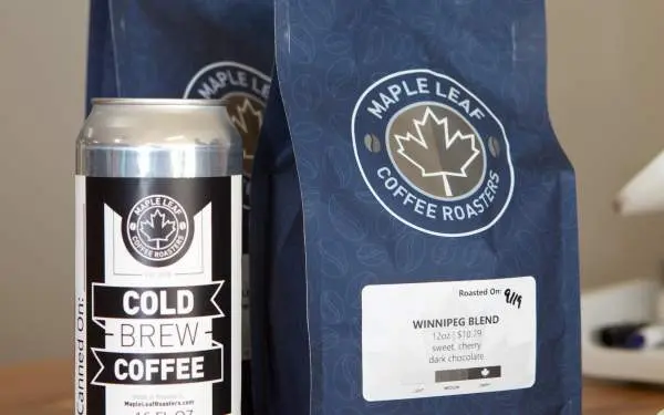 Can of cold brew coffee next to coffee bags