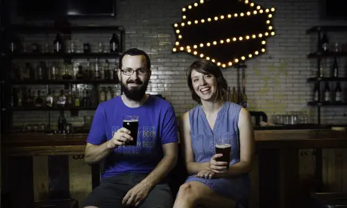 Two people drinking beer