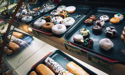 Sweets on trays inside glass container