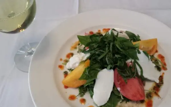 An appetizer plate with white wine from Timpone's Restaurant in Champaign-Urbana.