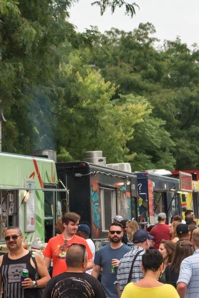 Food trucks line up on the side of the road