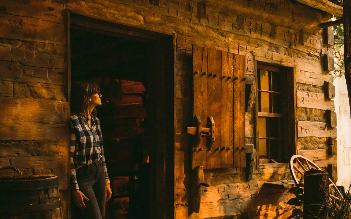 Woman standing and looking out the doorway at the Abraham Lincoln Presidential Library and Museum 