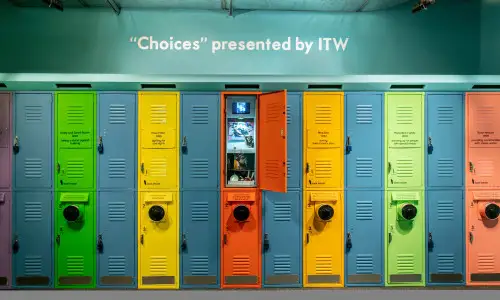 Colorful lockers with interactive screens at the Choices Holocaust Museum exhibit