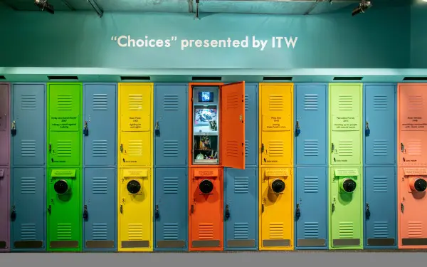 Colorful lockers with interactive screens at the Choices Holocaust Museum exhibit
