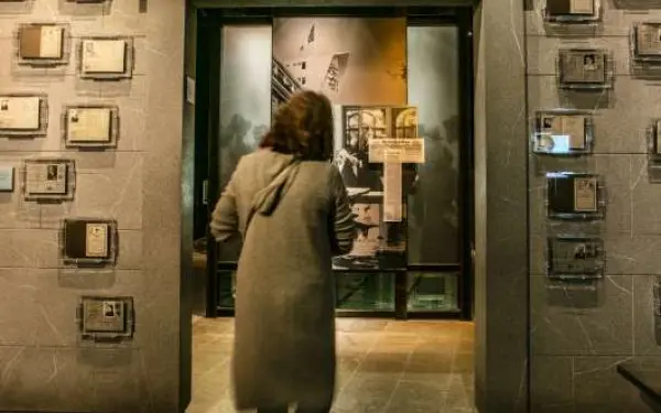 A women walking through a doorway at the  Holocaust Museum