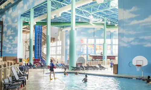 Lifeguard observing swimmers in the indoor pool