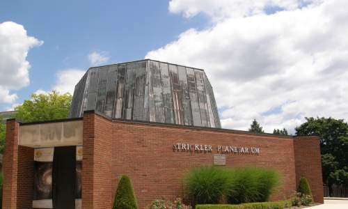 The exterior of Strickler Planetarium on a sunny day
