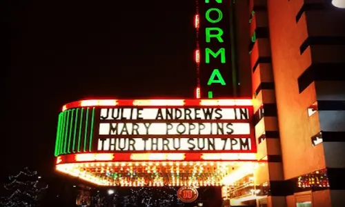 The exterior of Normal Theaters with lights