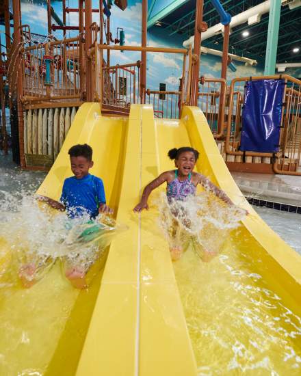 Kids sliding down the slide in the Great Wolf Lodge Waterpark.