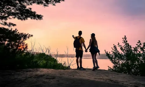 A Couple is Overlooking a River at Buffalo Rock Sate Park in Ottawa