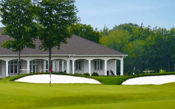 A building and a golf course in front of it