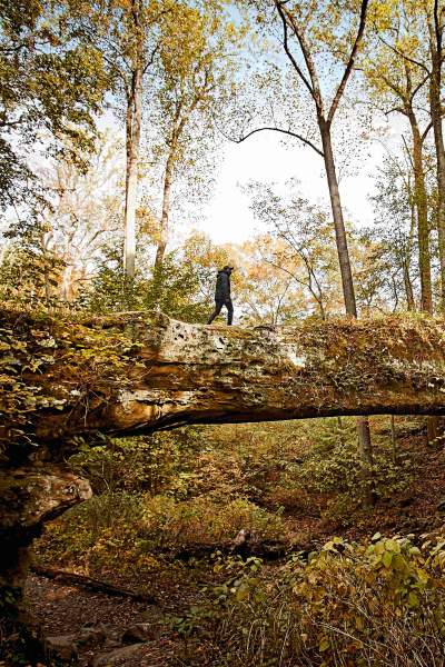 A person walking along the Pomona natural bridge in the Shawnee National Forest