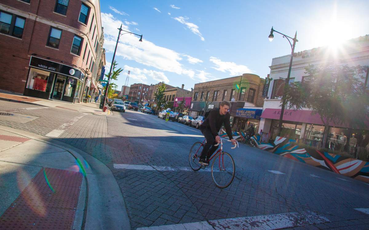 Man biking down Clark Street.