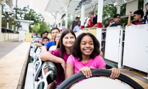 Kids on a amusement park ride at Six Flags.