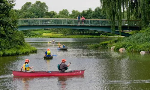 People canoeing down river 