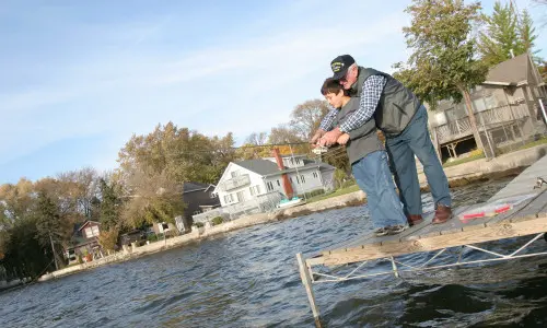 Grandfather and kid fishing 