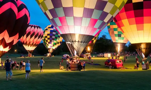 People enjoying the Great Galena Balloon Race at night.