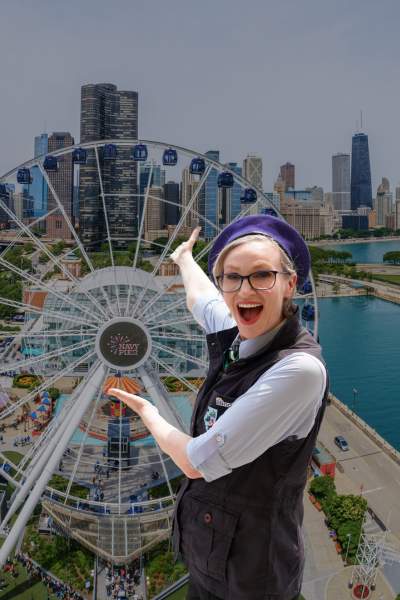 Jane Lynch superimposed over aerial image of Navy Pier and Chicago