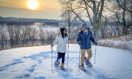A Couple enjoying skiing.