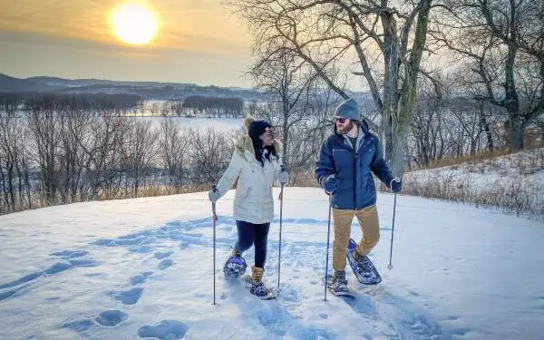 A Couple enjoying skiing.