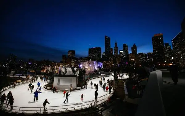 People ice skating on a track 