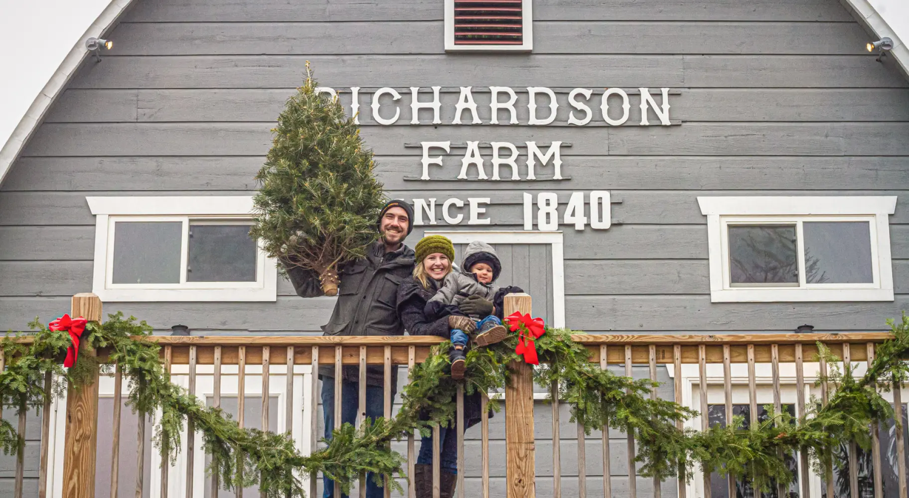 A family picking out a Christmas tree
