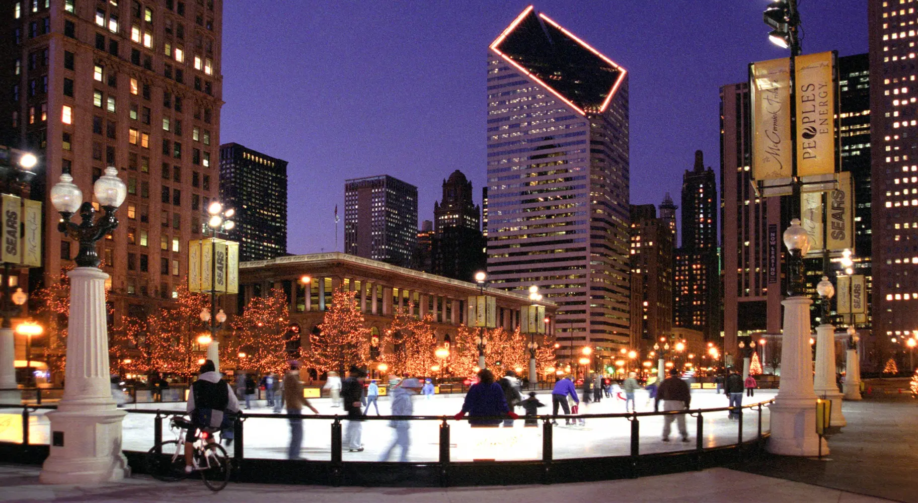 People Ice skating at night