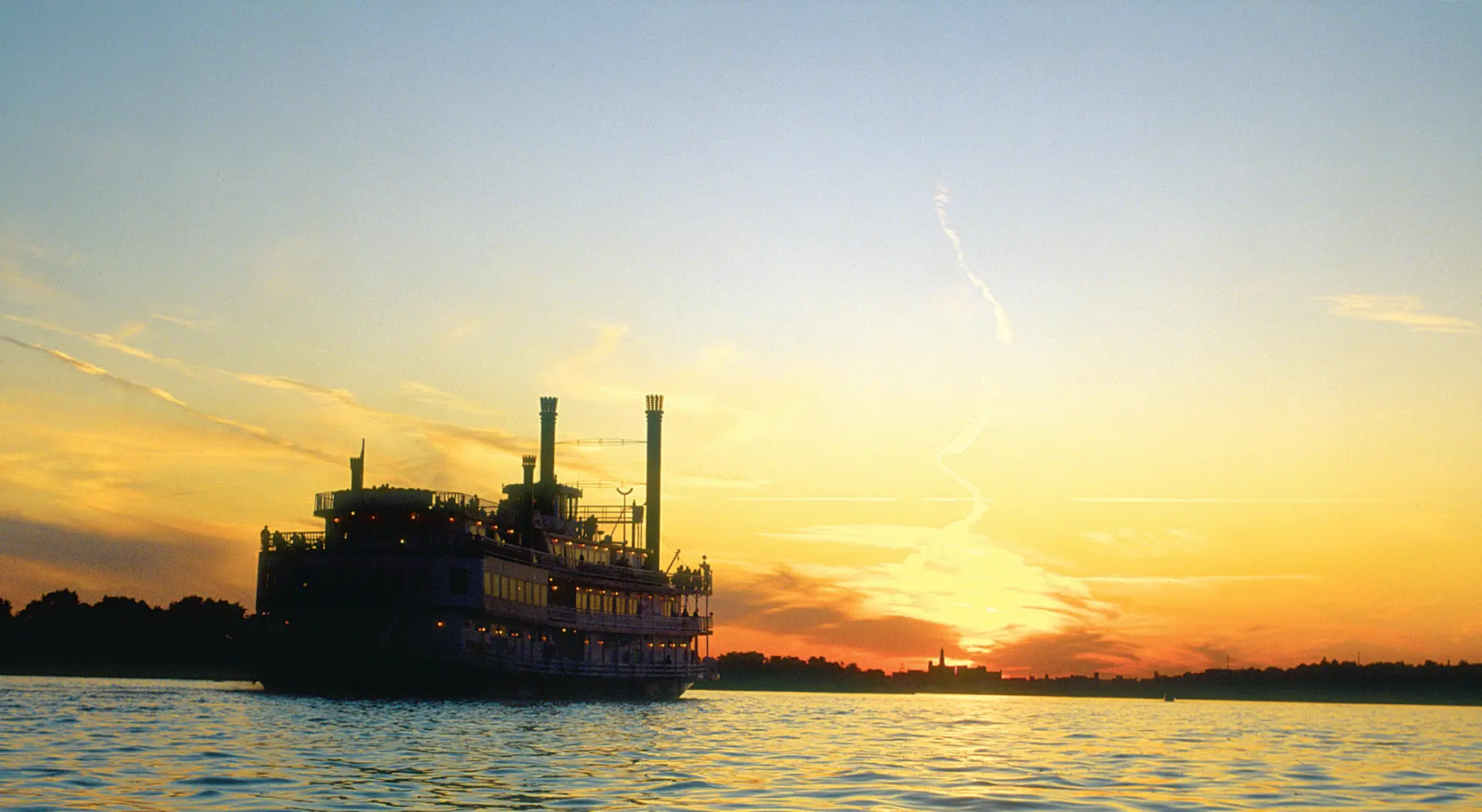 Sunrise with boat on a river