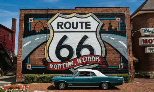 Route 66 Mural with a Pontiac car in front.