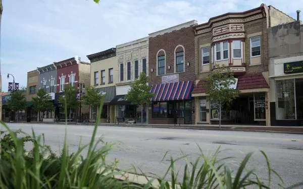 Line of storefronts down a main street in downtown DeKalb