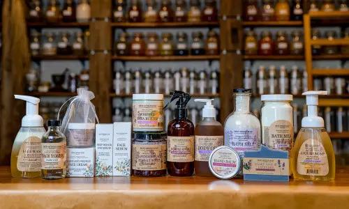 A selection of soaps and balms sitting on a counter at MION Artisan Soap in Wheaton, Illinois